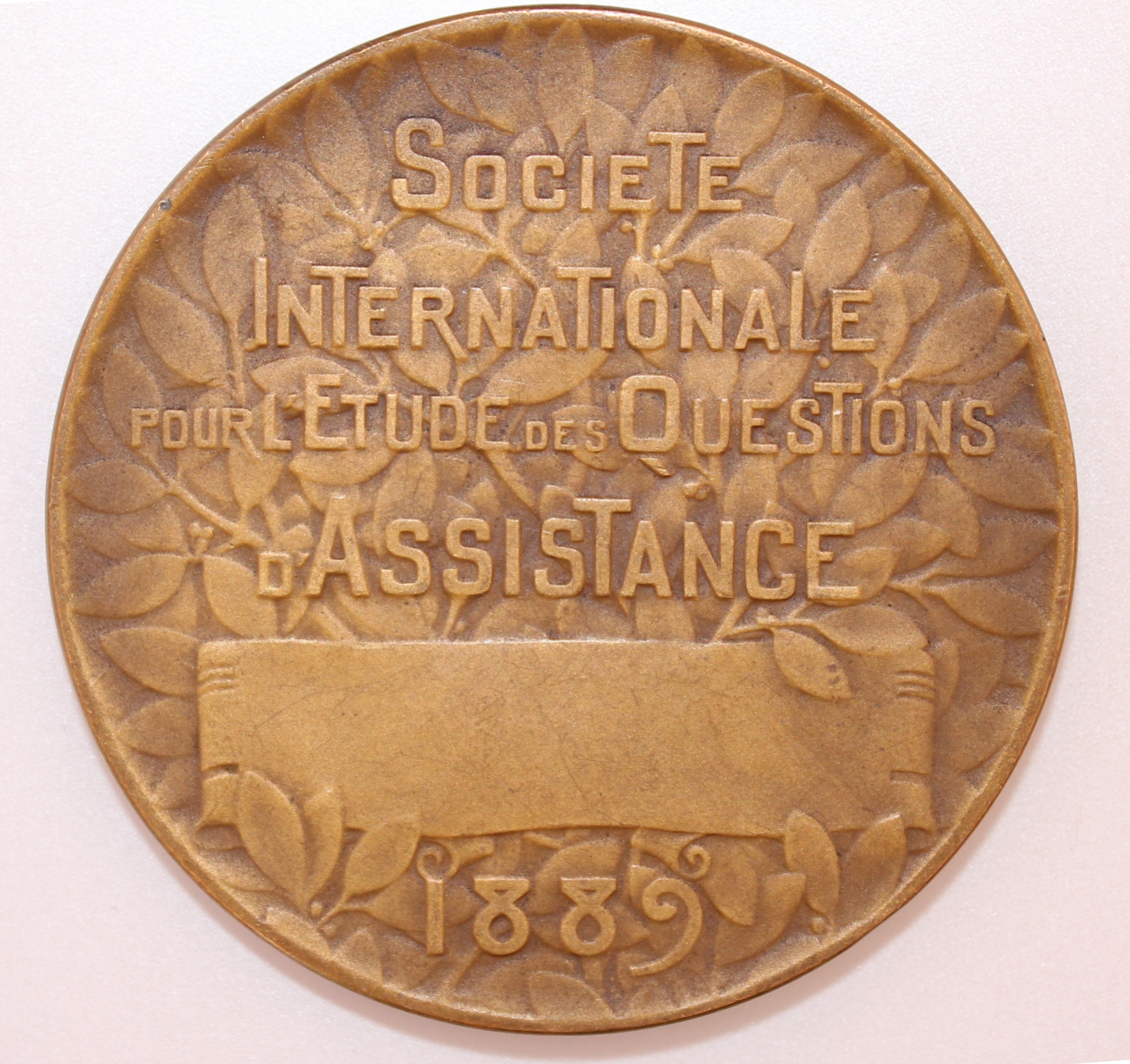 La Société internationale pour l’étude des questions d’assistance : Une médaille d’Alexandre Morlon de 1909